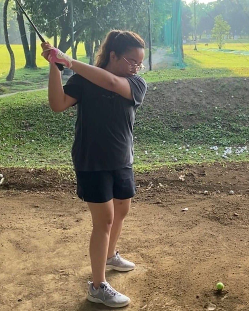 A member of Proto’s team mid-swing at a driving range
